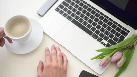 Woman's hand hold cup of coffee another hand tape on keyboard. Stock Footage 184020960
