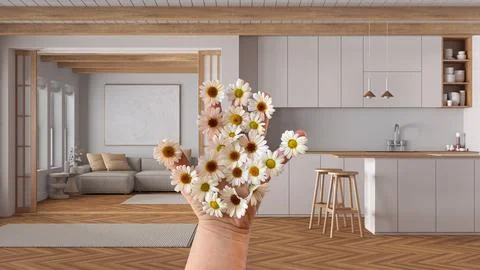 Woman's hand holding daisies, spring and flowers idea, over japandi wooden .. Illustrazione stock