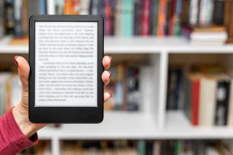 A woman's hand holding an e-book. A Stock Photos