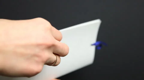 Woman’s hand holding holiday envelope, black background Stock Footage 33398599