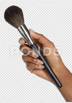 Woman's hand holding makeup brush for foundation or powder application PSD Template