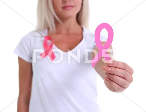 Womans hand holding pink breast cancer awareness ribbon Stock Photos