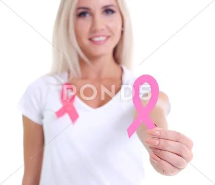 Womans hand holding pink breast cancer awareness ribbon Stock Photos