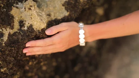 Woman's hand holding a stone Stock-Footage 66372452