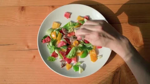 A woman's hand holds a fork, then sticks it into fresh apetite oatmeal. Video stock 234021909