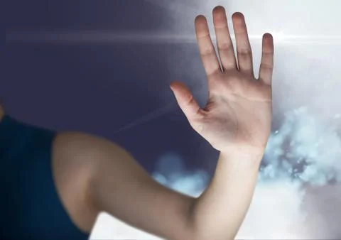 Womans hand interface screen against sky background Stock Photos