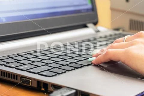Woman's hand on keyboard Stock Photos