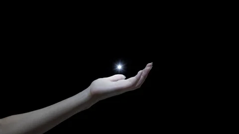 Woman's hand with a light flare in the middle of the screen, 4k footage with Stock Footage 115638833