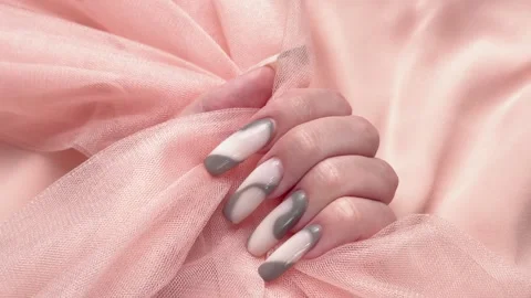Woman's hand with long manicure showing nail art design Stock Footage 344835891