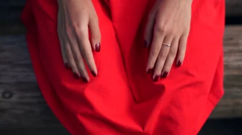 Woman's hand make a heart shape and holding a red heart shape. Stock Footage 63355846