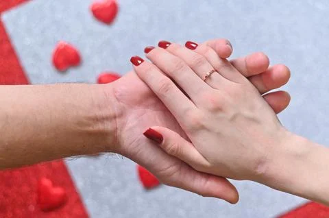 A woman's hand in a man's. Stock Photos
