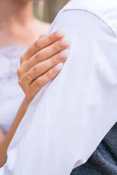 A woman's hand on a man's shoulder. The concept of support and reliance on me Stock Photos