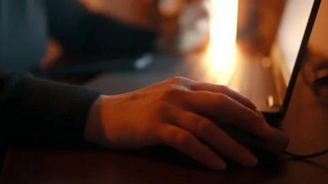 Woman's hand moves the mouse and presses fingers on the laptop keyboard Stock Footage 238434496