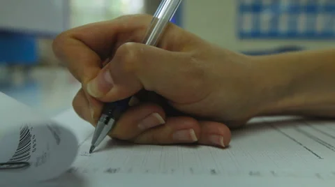 Woman's Hand Neatly Complete a Form. Woman Writes With a Pen. Closeup Stock Footage 64621949