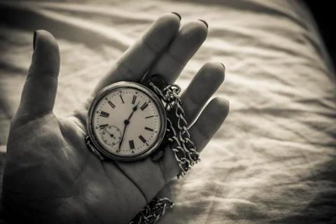 Woman's Hand with an Old Pocket Watch Stock Photos