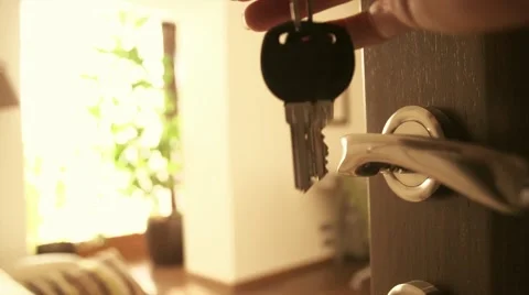 Woman's hand open a door of comfortable apartments and enter inside. Keys Stock Footage 50039455