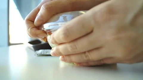 Woman's hand is opening dish with a salad in fast food Stock Footage 100194055