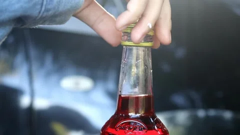 A woman's hand opening the lid of marjan red syrup Video stock 280893271