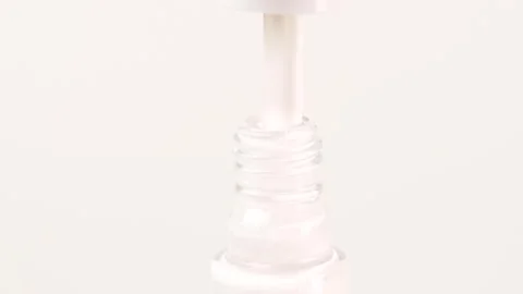 Woman's hand opens a bottle of nail polish. Stock Footage 302919075