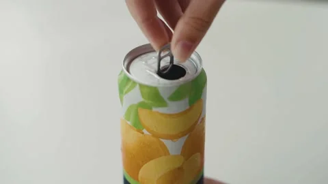 Woman's hand opens a can of lemonade Stock Footage 139044325