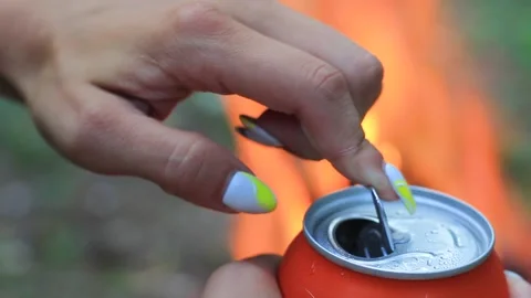 A woman's hand opens a tin can of beer close-up. Stock Footage 158060736