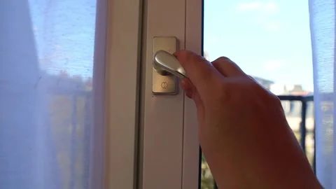 Woman's hand opens the window Stock Footage 299381030