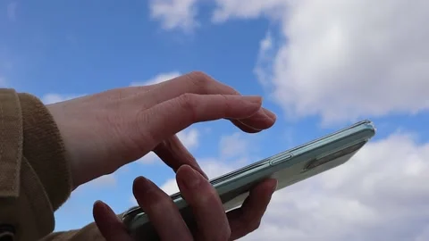 Woman's hand operating a smartphone, Part 3 Stock Footage 234282130