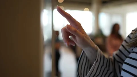 Woman's hand paying with mobile phone using nfc technology and then using her Stock Footage 344295268