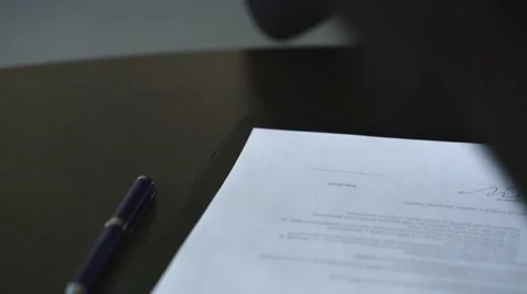 Woman's hand with pen signing document, close up Stock Footage 67881907