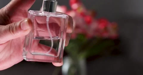 A womans hand with a perfume bottle Stock-Footage 312591461