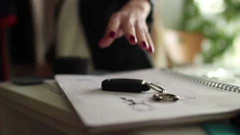 Woman’s hand picking car keys while walking Stock Footage 164148183