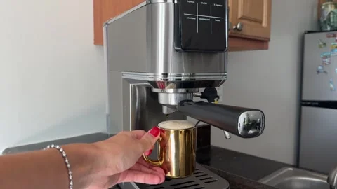 Woman's hand picking up Cup of coffee from coffee machine Stock Footage 342062344