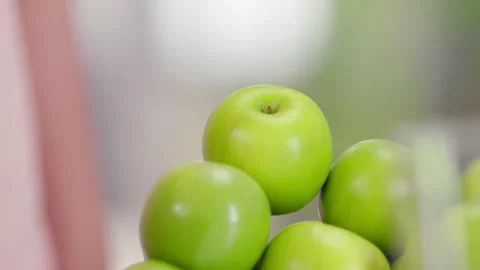 Woman's hand picking up a green apple Video stock 278273717