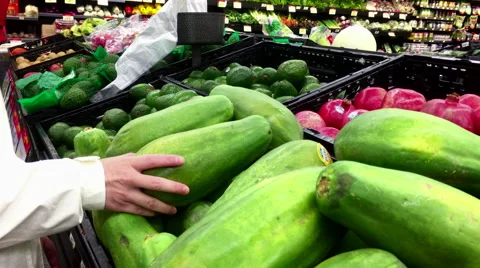 Woman's hand picking papaya inside Walmart store 스톡 동영상 68362258