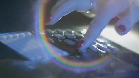 Woman's hand picks up the receiver of a black shiny push-button old telephone Stock Footage 287948655