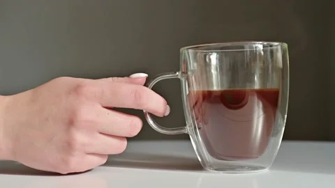 A woman's hand placed a coffee cup on the table, Side view, Slow motion Stock Footage 172139915