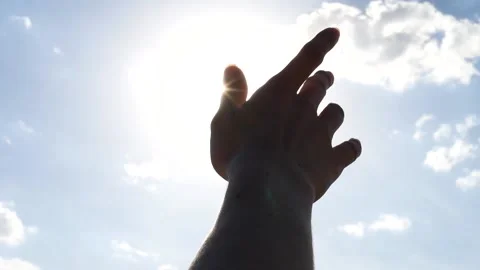 A Woman's Hand Is Played With The Rays Of The Sun Video stock 154276436