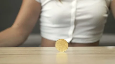 Woman's hand is playing with bitcoin. Stock Footage 238018993