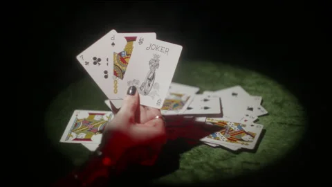 Woman's hand playing cards spotlight Stock Footage 316548971