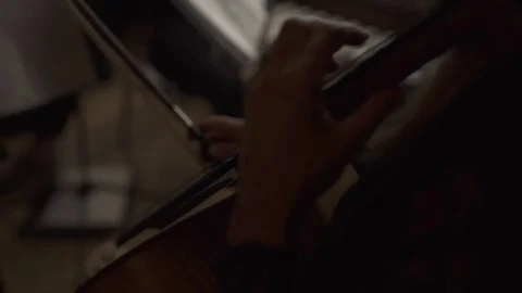 Woman's hand playing cello classical music instrument Stock Footage 84700290