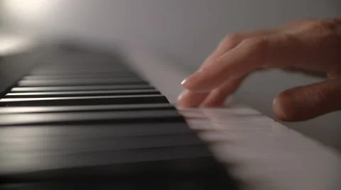 Woman's hand playing the piano Stock Footage
