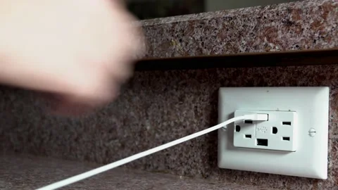 Woman's Hand Plugging In iPhone Lightning cord 4K Stock Footage 208807254