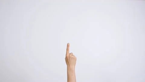 A woman's hand points up to an empty space on a white background.  Stock Footage 230526672
