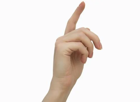 A woman's hand points to a white background Stock Photos