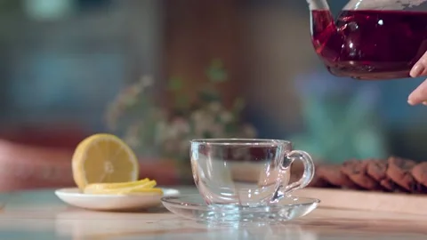 Woman's hand pouring tea Stock Footage 137225658