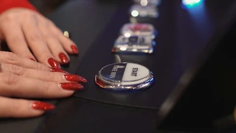 Woman's hand presses button on slot Stock Video Pond5