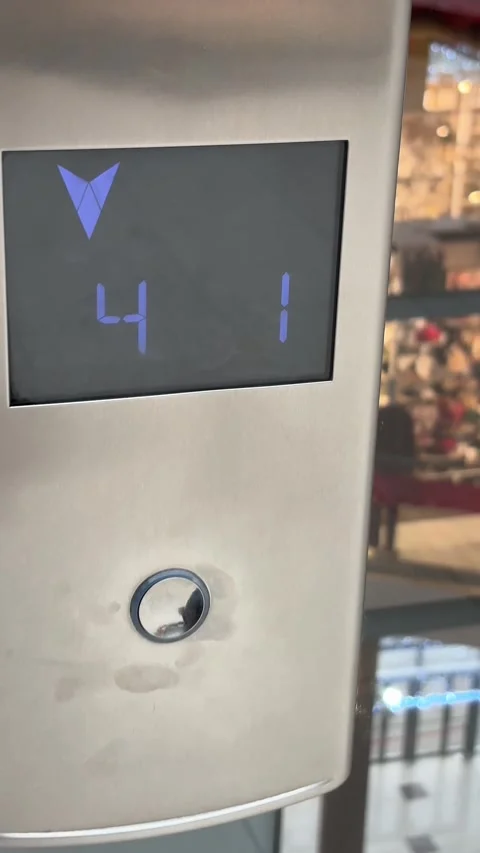 A woman's hand presses an elevator button. Vertical video. Video stock 329779999