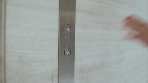A woman's hand presses the elevator call button 스톡 동영상 170421926
