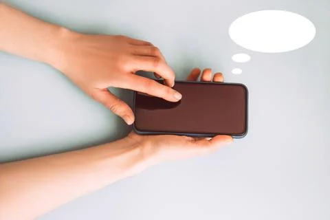 Woman's hand is pressing the button on smart phone screen Stock Photos