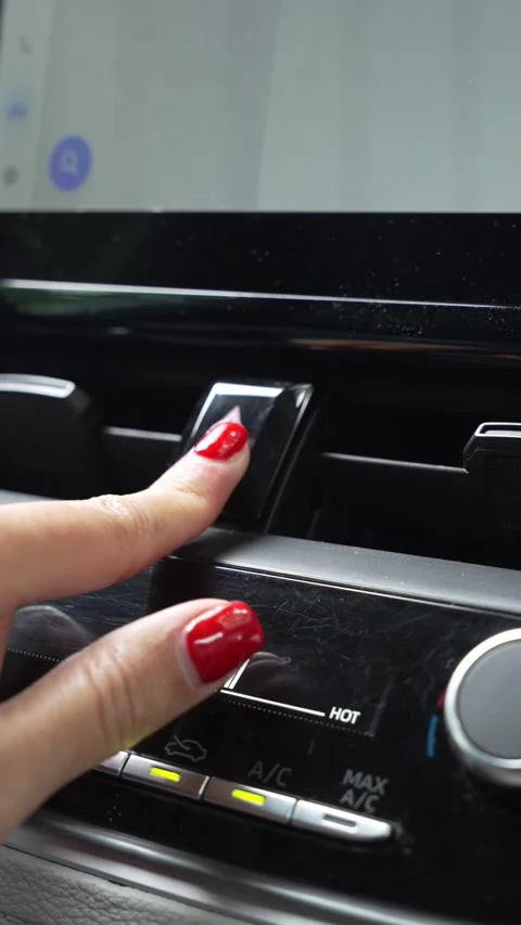 Woman's hand pressing the hazard warning triangle button Stock Footage 345011568